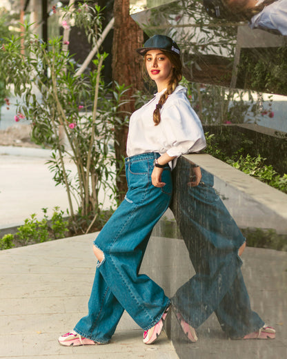 XAYWEAR white shirt for women styled with high-waisted ripped jeans and pink sneakers