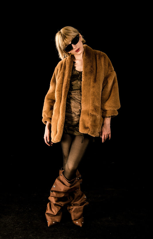 XAYWEAR brown faux fur winter jacket for women styled with sunglasses and matching boots