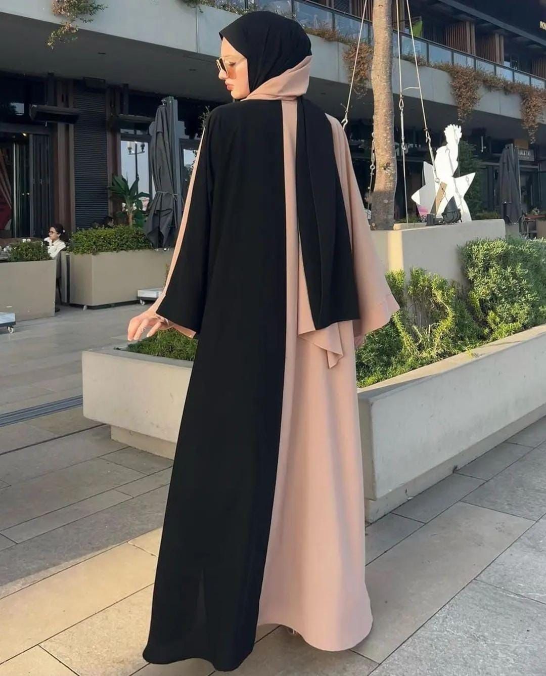 Stylish women black abaya with contrasting beige accents, perfect for modest fashion lovers