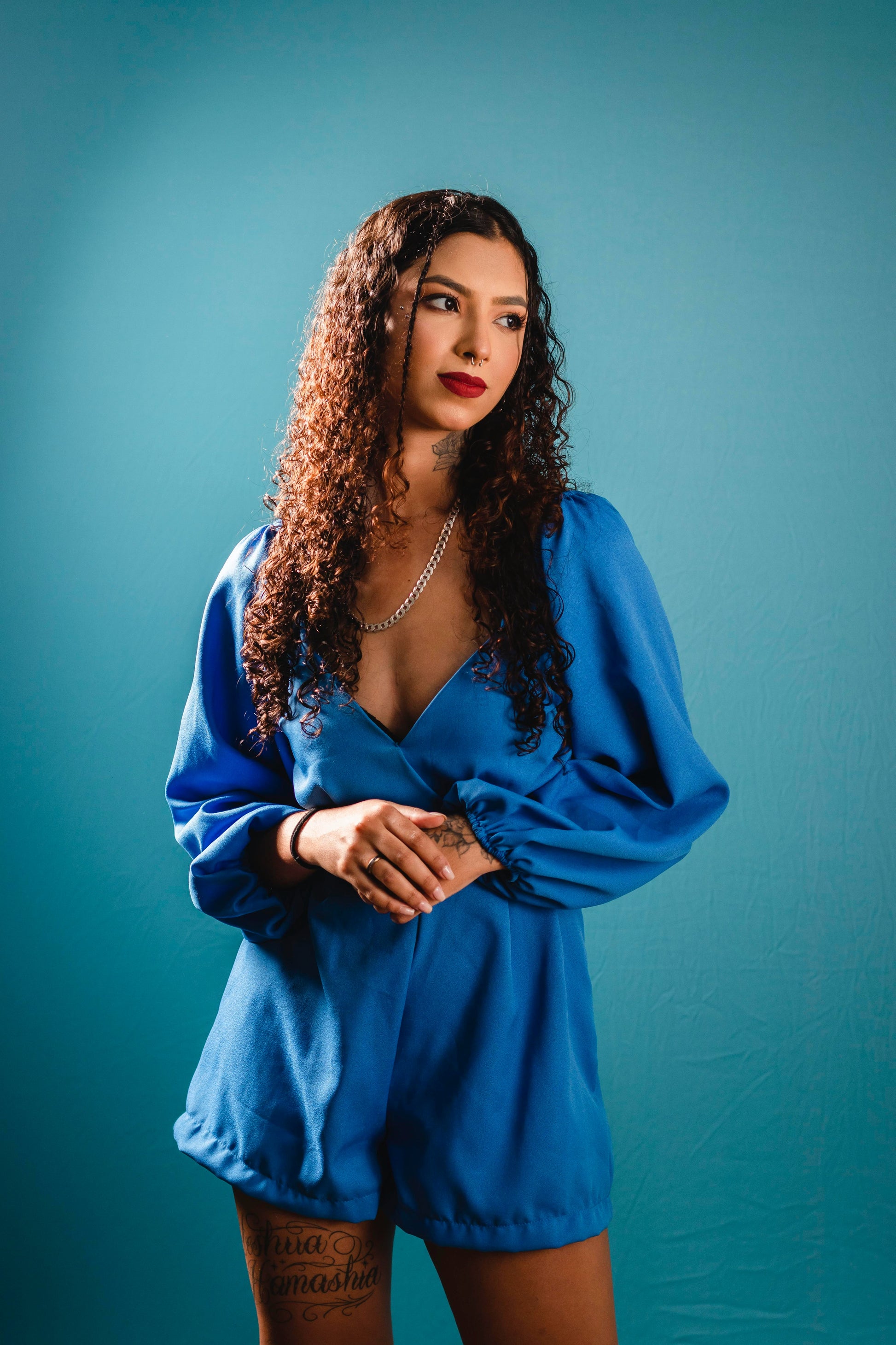 Women blue jumpsuit by XAYWEAR with long puff sleeves and deep V neckline