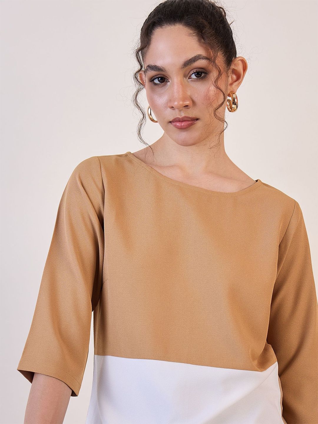Stylish boat neck blouse for women in beige and white with three-quarter sleeves