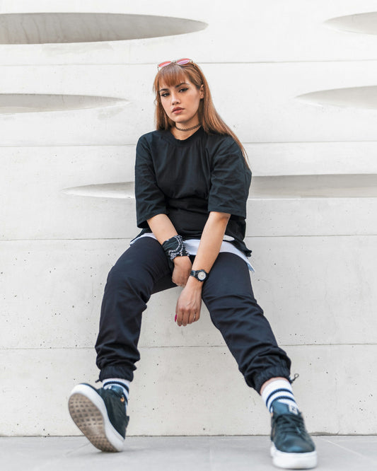 XAYWEAR women's casual shirt in black with relaxed fit, paired with stylish drop-crotch pants