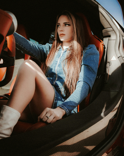 XAYWEAR women denim midi dress worn by a woman sitting inside a car with white boots
