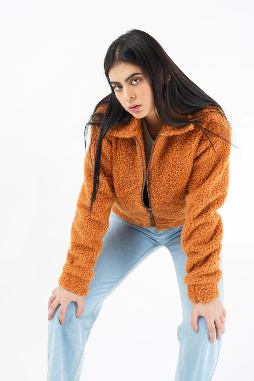 Stylish women faux fur jacket in orange with a zipper and cozy design for a trendy look