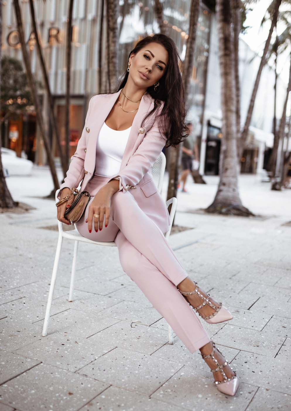 XAYWEAR women formal suit in light pink with matching pants and blazer styled with heels and accessories