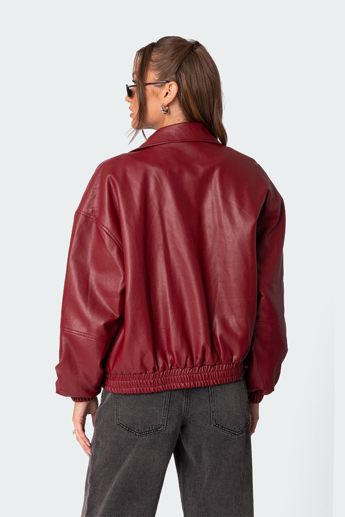 Back view of XAYWEAR women leather jacket in red with elastic hem and relaxed fit