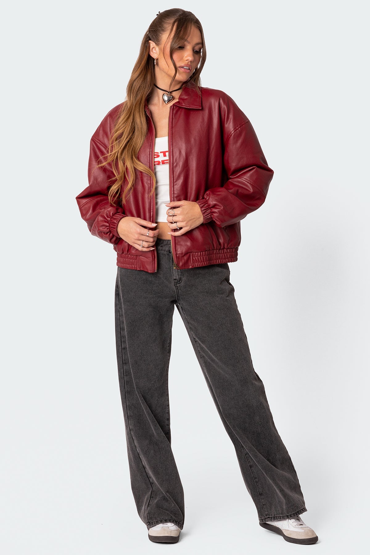 XAYWEAR women leather jacket in red worn with casual black pants and white sneakers