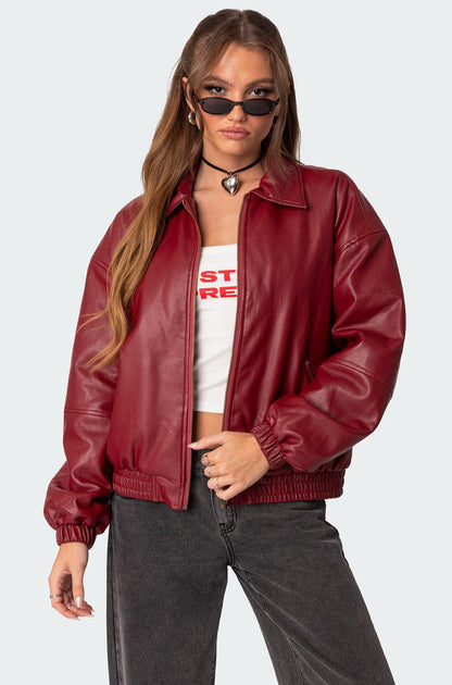 XAYWEAR women leather jacket in red with a zip front and elastic cuffs worn with black jeans