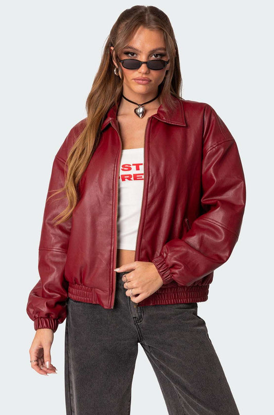 XAYWEAR women leather jacket in red with elastic cuffs and collar worn with black jeans and sunglasses