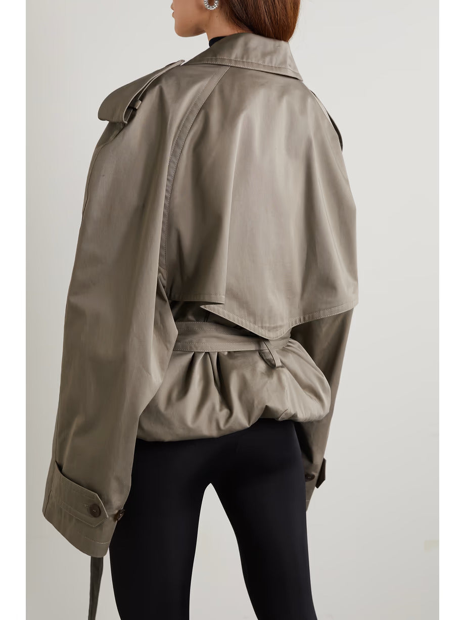 XAYWEAR women trench coat in taupe color shown from the back with belted waist and storm flap detail
