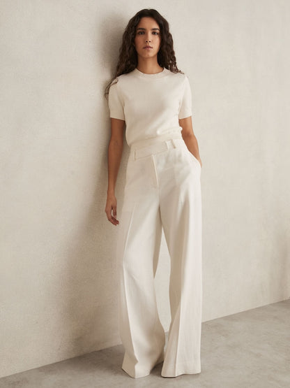 XAYWEAR women trouser in cream color with wide-leg fit styled with a matching short sleeve top