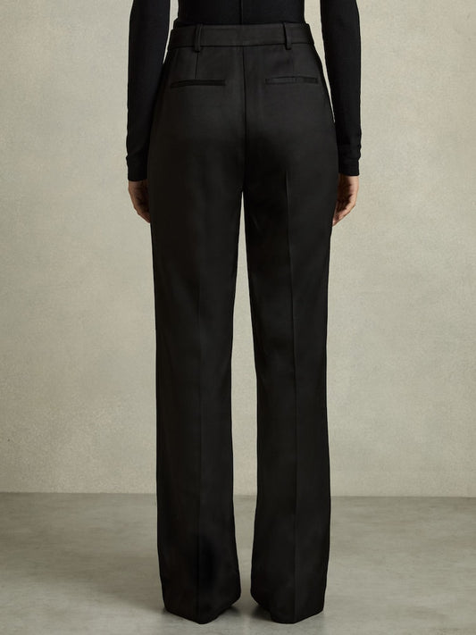 XAYWEAR black women's pants with a straight leg fit and back pockets on a standing model