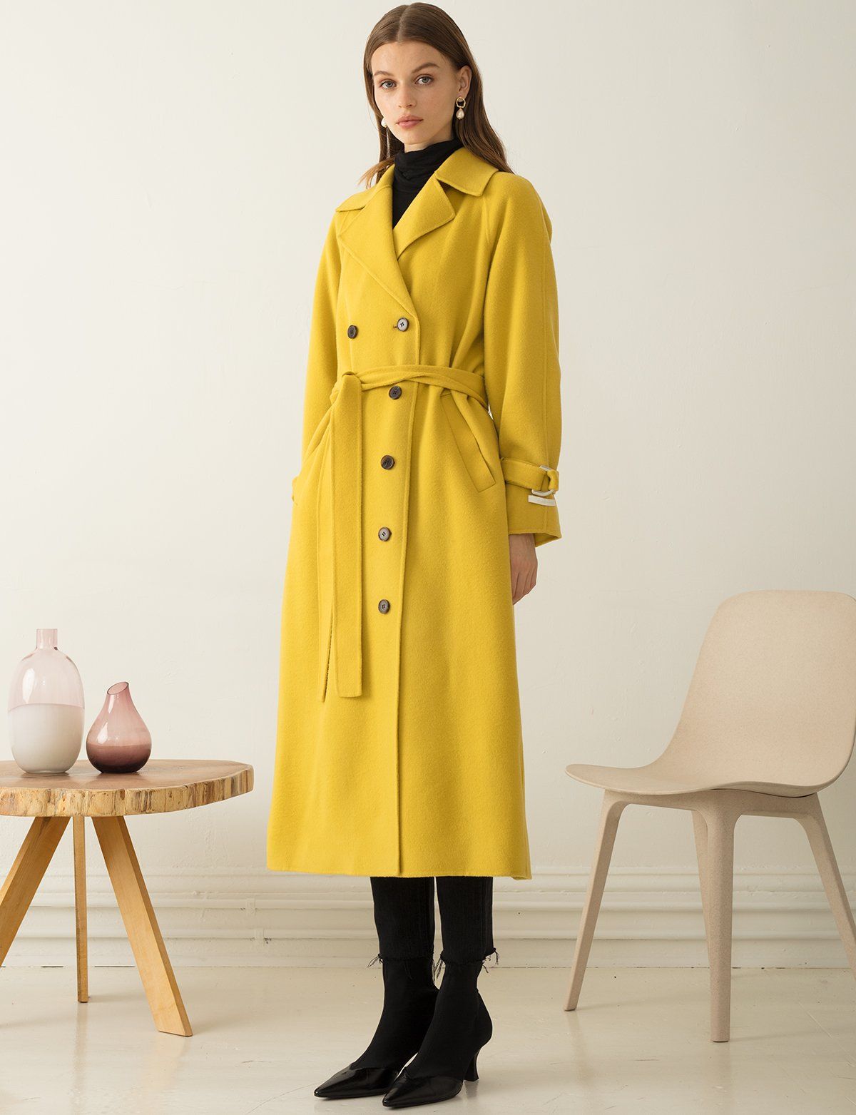 XAYWEAR yellow long winter coat women with belt and button details styled with black boots