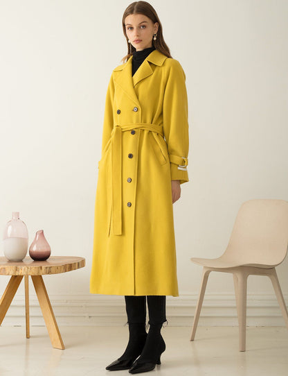 XAYWEAR yellow long winter coat women with belt and button details styled with black boots